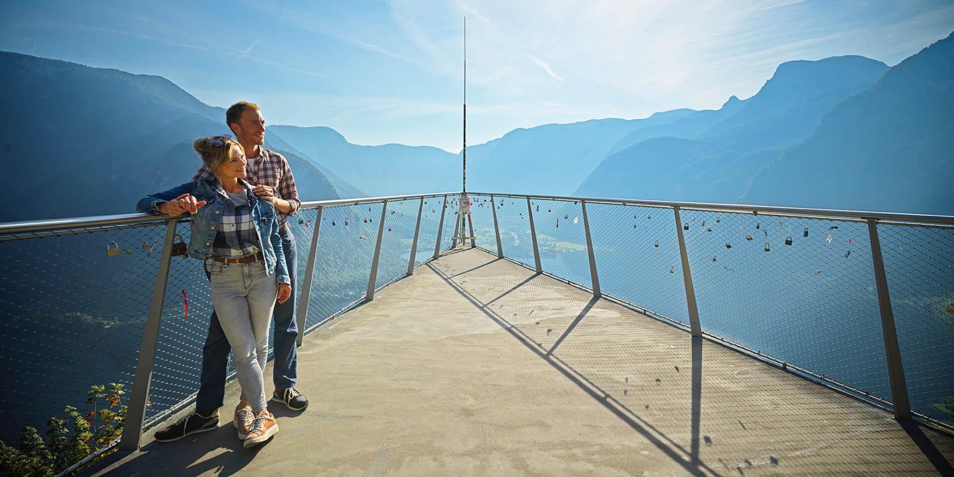Hallstatt - Couple stands at the Skywalk World Heritage View with panoramic view of the mountains - Hallstatt Tour with Salzburg Panorama Tours